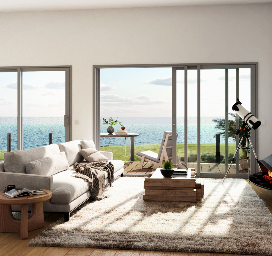 Intérieur d'un appartement, avec une fenêtre en fond, et vue sur l'océan